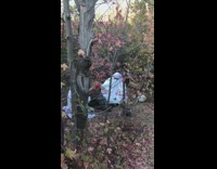 Two people ghost blanket maroon leaves pictorial