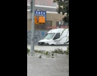 Flooded street with cars sink on water