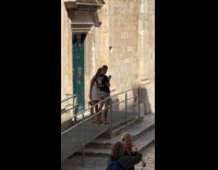 Woman white dress unhappy at boyfriend photoshoot