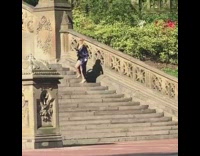 Woman shiny violet dress run up stairs