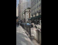 Skeleton wears hat and sunglasses in car