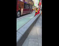 Lady poses in red outfit tour bus