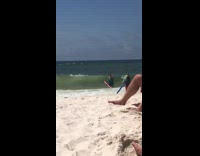 Woman gets hit by strong wave