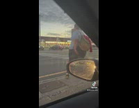 Woman stops in middle of the street poses and walks