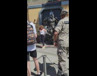 Woman white top dance beside megatron transformers