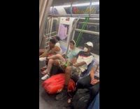 Man using stretch band tied on subway hand rails