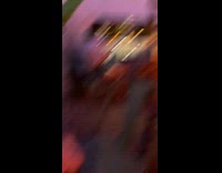 Girl holds drinks up by face restaurant 