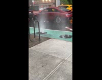 Submitter shows sewer spews water during thunderstorm