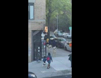 4 pedestrians walk in stilts 