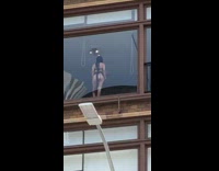 Women bikini stands on glass wall of building