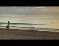 Two women white dress pink shorts beach