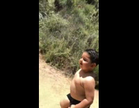Guy running with his shirtless little brother summer body