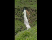 Waterfalls come from cave cliff mountain Nepal