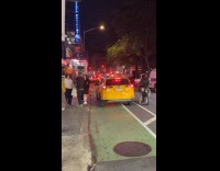 Garbage in dumpster on street burns night