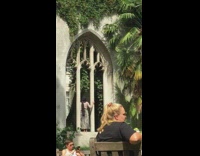 Girl black hijab stand in large window