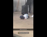 Kid on all fours at subway platform 