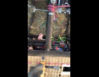 Tourists sitting inside tipped over hot air balloon