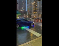 Blue car with colorful LED lights underneath 