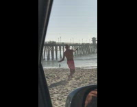 Collab Kook Of The Day - guy pink shorts at beach doing weird dance