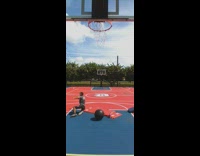 Guy bounces ball off backboard and kicks it into hoop