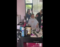 Guy cuts off his long hair 