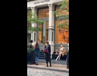 Girl two brown dogs louis vuitton store 