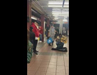 Old man at the subway station looks like Santa 