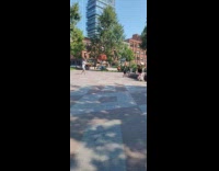 Collab IITW - Woman black dress poses front of fountain