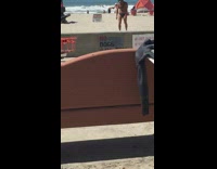 MUSIC White Helmet Guy Carries Surfboard on Head on Beach