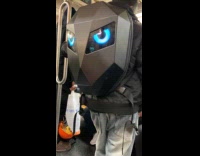 Man with digital backpack eyes in subway