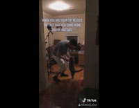 Guy blue shirt living room dance cat