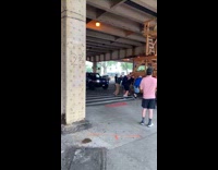 Men transport wood scaffolding prepare for festival
