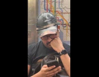 Man wearing baseball hat with eyes print