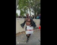 Man films pet halloween costumes at a park