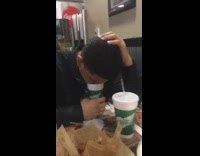 music guy black shirt resting face on cup