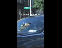 Guy black tape on street pole