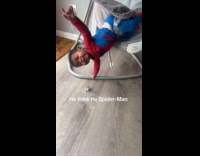 Baby acts like spiderman falls from chair