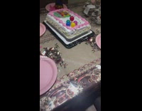 Filmer takes handful of cake and stuffs girl in face