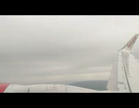 Time lapse plane ride wing cloudy overcast