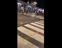 Group of skaters passing through street