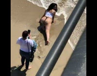 Girl thong kneel one straight leg beach