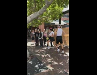 Couple puts water balloons on womans chest