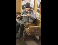 Woman eats meat off a big bone while sitting on a bench in the subway station #BluePointWhatTheL