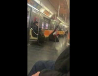 Guy dances on train by passenger 