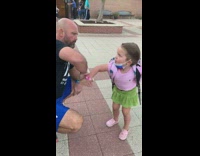Little girl doing wholesome goodbye handshake before school with dad