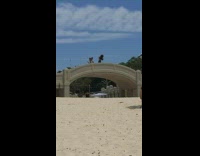 Guy voice over girl on bridge beach