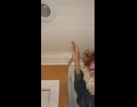 Guy trying to hide holes in ceiling 