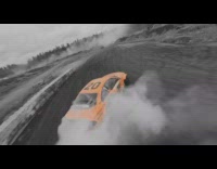 Drone orange car drives down street smoke