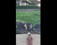 Bikini girl poses with butt facing phone 