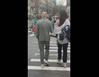 Guy with face drawn on back of head 